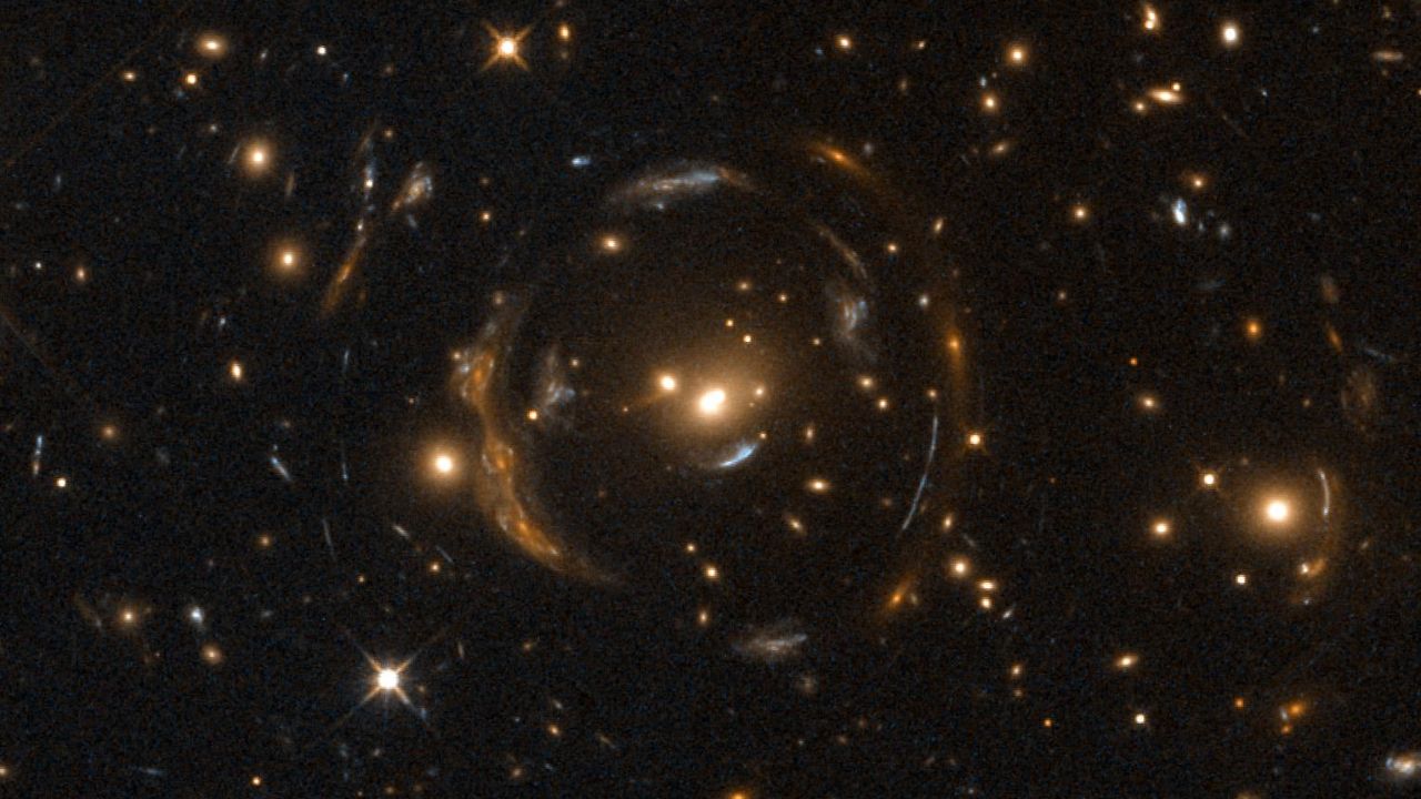 Einstein Cross A carousel lens found in the universe which makes deep space look bigger when looked at